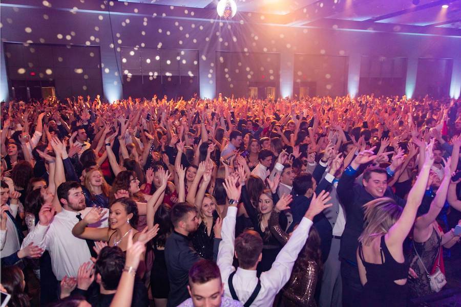 large group of people dancing at the Presidents' Ball